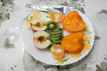 Variety of sliced fruit on a plate