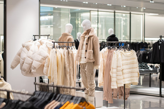 The Interior Of A Fashion Store Of Women's Clothing Of A Famous Brand. Mass Market. Brand Clothes. All Things Are Laid Out Neatly On The Shelves In The Closet. Wardrobe Order.