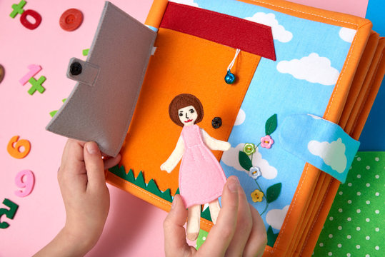 CHILDREN'S TEXTILE TRAINING BOOK. TOY HOUSE FROM FELT, CHILD PLAYING HANDS