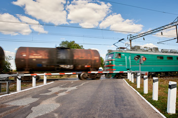 Fototapeta na wymiar Rides a train, railway crossing. Motion blur.