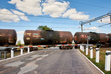 Fototapeta na wymiar Rides a train, railway crossing. Motion blur.