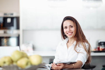 Woman business worker in modern bright coworking office working with laptop, interior designer.