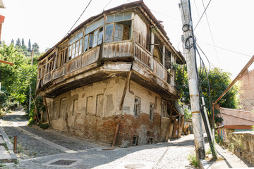 A typical georgian street and yard of an old traditional house and clothes and linen drying on the ropes. Tbilisi Georgia, Caucasus mountains.