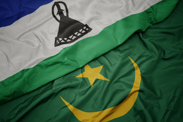 waving colorful flag of mauritania and national flag of lesotho.