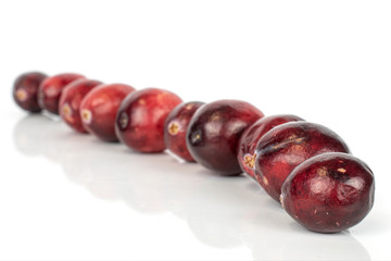 Lot of whole fresh red cranberry diagonal isolated on white background