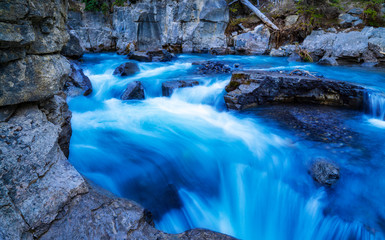 Beautiful Slow Shutter Blue River Stream Flowing Over Gentle Relaxing Rocks