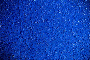 Water drops on the blue fabric.water drops on blue background