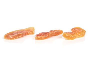 Group of three whole dried orange papaya piece isolated on white background