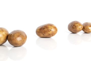 Fototapeta premium Group of five whole disordered tiramisu brown almond nut isolated on white background