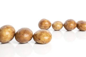Fototapeta premium Group of seven whole tiramisu brown almond nut isolated on white background