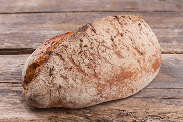 Traditional homemade bread on wooden background. Natural homemade product. Healthy food concept.