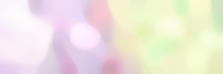 blurred bokeh horizontal background with light golden rod yellow, lavender blush and thistle colors and space for text