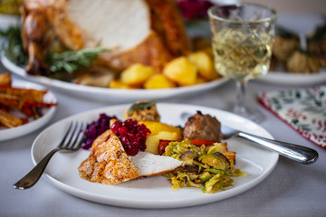 Fototapeta na wymiar Christmas dinner with roast turkey crown and vegetables