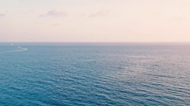 Panorama of the Mediterranean Sea at sunset. Warm quiet summer evening