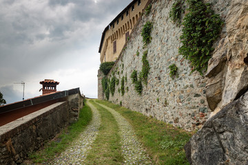 a cobbled street inside the castle wall of Roppolo town, Province of Biella, region Piemonte, Italy