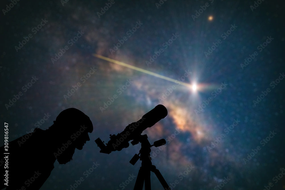 Wall mural astronomer with a telescope watching at the stars and moon. my astronomy work.