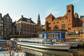 Amsterdam boats on the canal in Damrak area