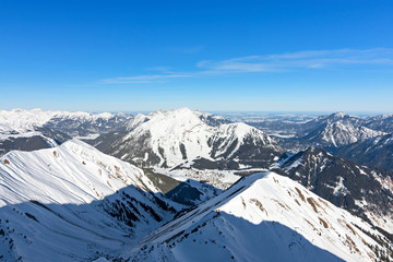 Snow-covered alpine landscape around the mountain village Berwang in Tirol, Austria. Copy space