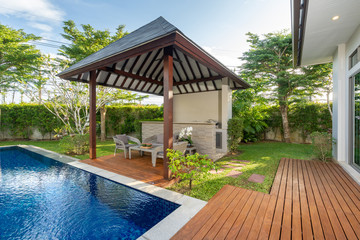 swimming pool and pavilion with green garden