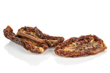 Group of three whole dried red tomato piece isolated on white background