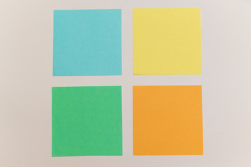 Fototapeta premium multicolored stickers. papers for records. office tools on the white backround