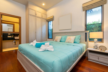 Modern bedroom with working desk and bedding