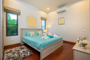 Modern bedroom with working desk and bedding