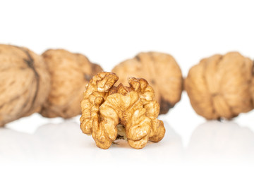 Lot of whole one piece of ripe fresh brown walnut isolated on white background