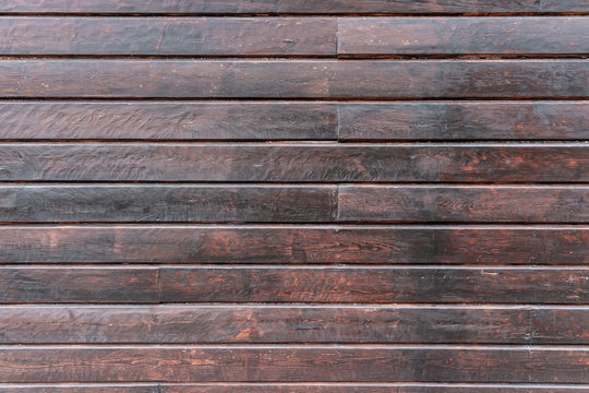 Texture of horizontal brown painted planks. Light background.