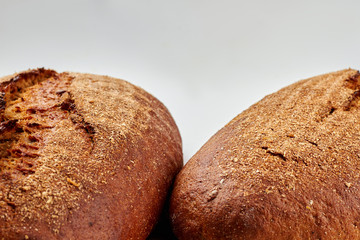 Healthy fresh bread and copy space. Delicious homemade bread on white background. Gluten-free bread recipe.