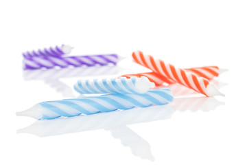 Group of six whole birthday cake candle isolated on white background