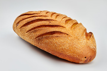 French bread on white background. Homemeade baguette with sesame seeds. Gluten-free homemade product.