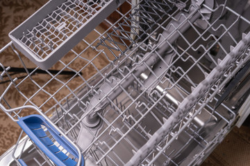 Dishwasher, gray mesh dishwasher. Selective focus.