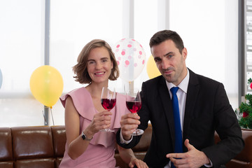 A couple celebrate happy new year and christmas day party with wine