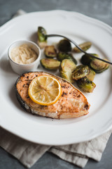 Salmon steak served with brussel sprouts