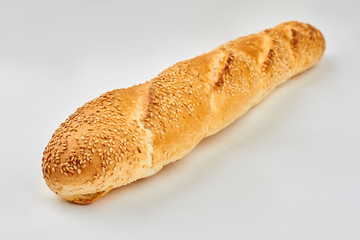 French baguette isolated on white background. Fresh loaf of french bread. Space for text.