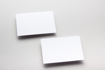 Business card blank on wooden background. Corporate Stationery, Branding Mock-up. Creative designer desk. Flat lay. Copy space for text