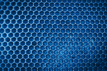Honeycomb background toned in classic blue color trend of the year 2020