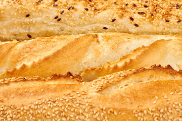 Texture of crusty french baguettes. Golden crust of french loaves and ciabatta.