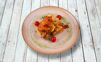 Pie with cheese, pork, mushrooms and baked tomatoes.