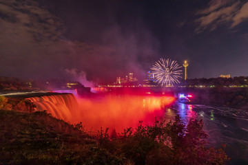 Niagara Falls - fireworks and a colorful illuminations of the waterfall. View from American Side
