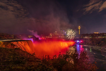 Niagara Falls - fireworks and a colorful illuminations of the waterfall. View from American Side