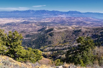 Fototapeta premium Wasatch Front Rocky Mountain landscapes from Oquirrh range looking at Utah Lake during fall. Panorama views near Provo, Timpanogos, Lone and Twin Peaks. Salt Lake City. United States.
