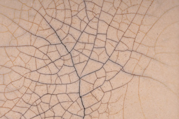 Cracked enamel. Old pottery. Cracks on a smooth surface. © Виктор Кеталь
