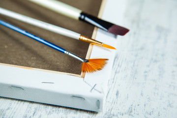 Paint brushes and paints for drawing on desk