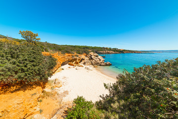 Blue sky over a small cove in Alghero shore