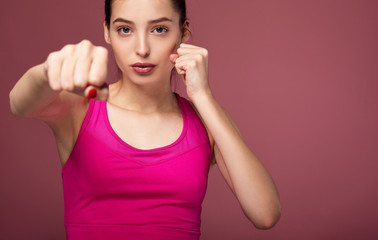 Close up of a girl boxing.