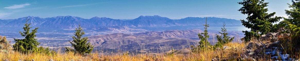 Wasatch Front Rocky Mountain landscapes from Oquirrh range looking at Utah Lake during fall. Panorama views near Provo, Timpanogos, Lone and Twin Peaks. Salt Lake City. United States.