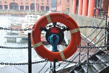 Life belt and basin on the Royal Albert Dock in Liverpool, England, Europe. The docks are a Unesco...