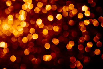 Abstract gold color defocused bokeh background.